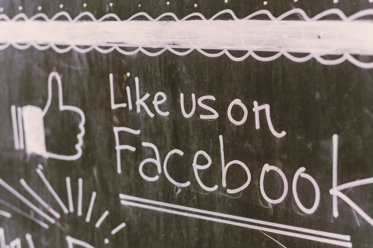home-services-01 Chalkboard art promoting Facebook engagement with a like us message.
